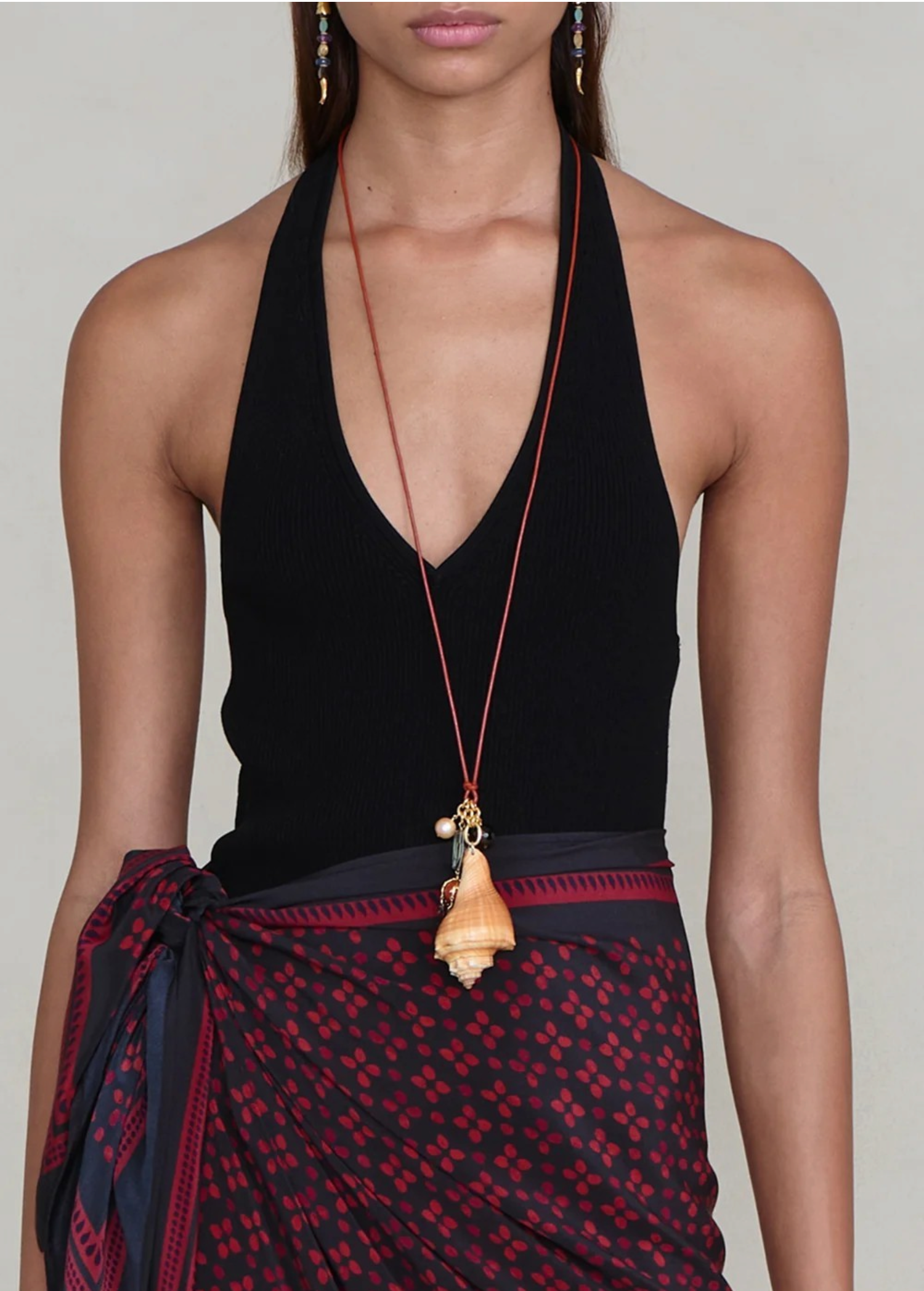 KABE SHOP INC shell necklace featuring a natural seashell pendant and colorful stone accents on adjustable leather cord
