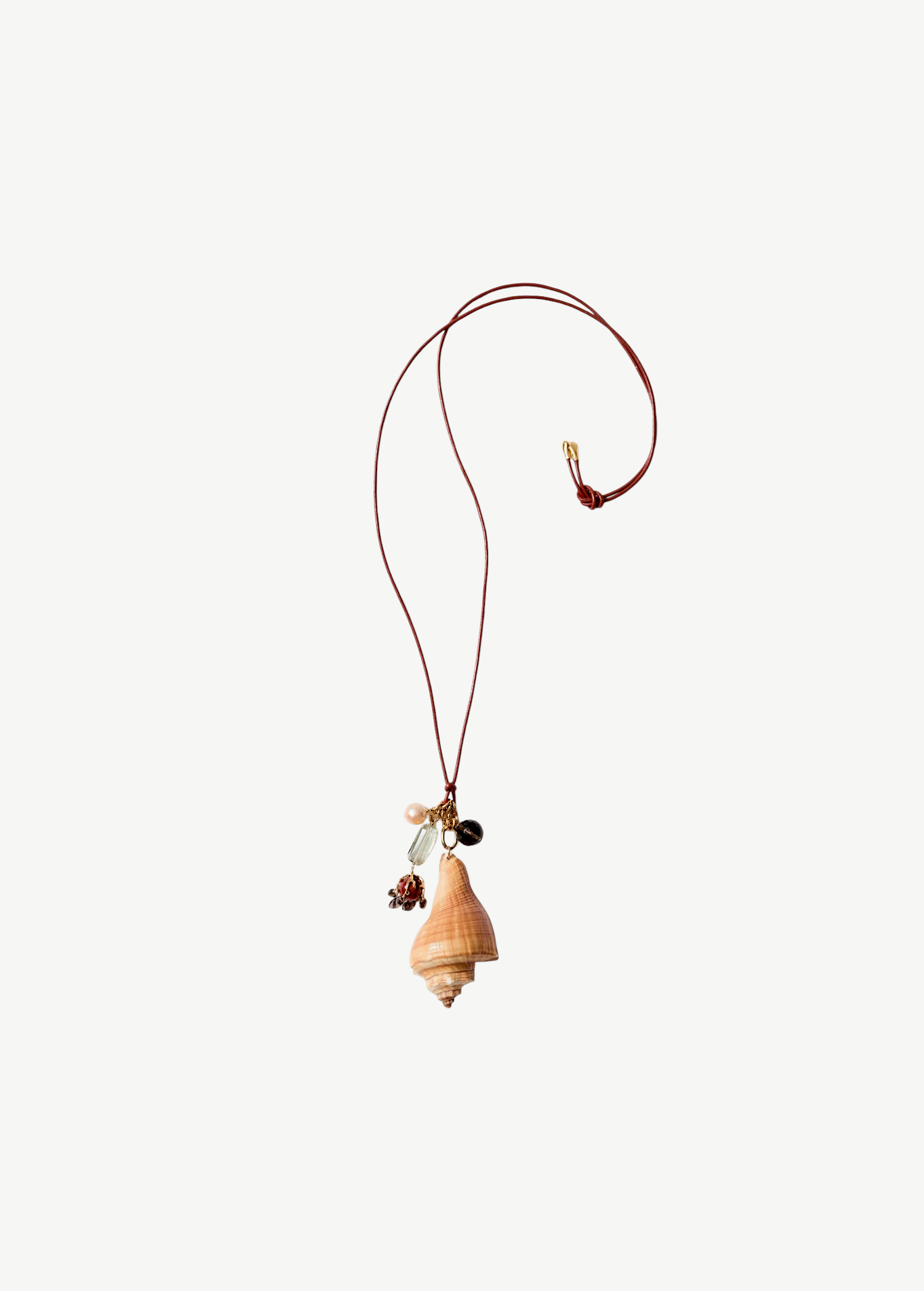KABE SHOP INC shell necklace with colorful stone charms and beads on an adjustable brown leather cord