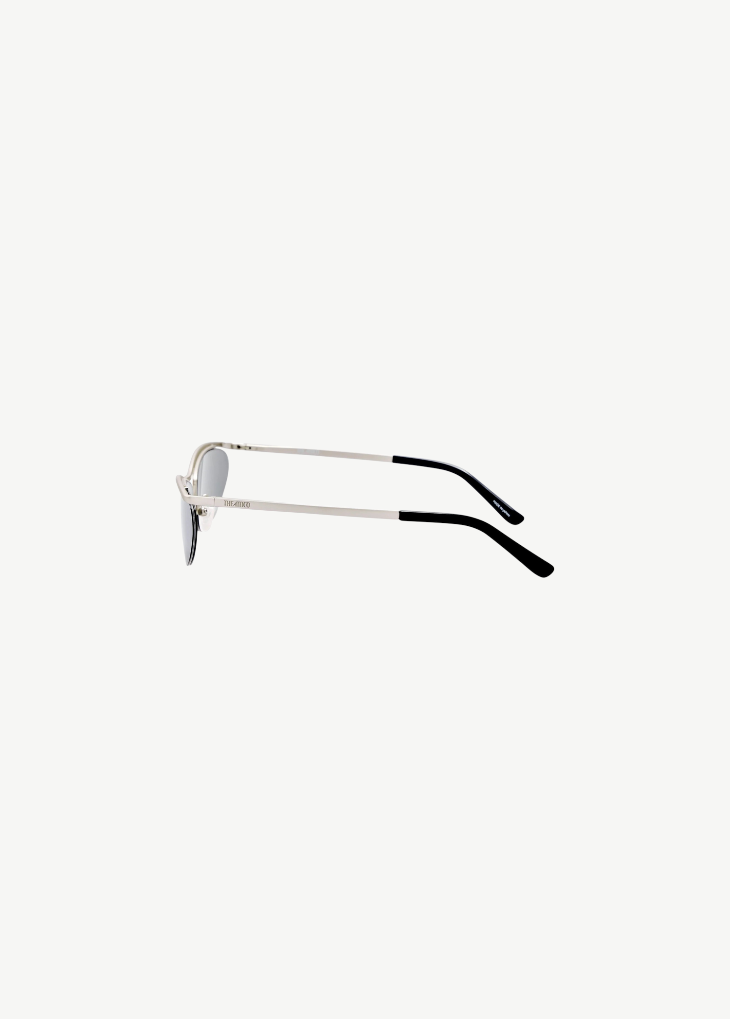 KABE SHOP INC Charlotte cat-eye sunglasses with silver-tone metal frame, dark gray lenses, and engraved logo detail.