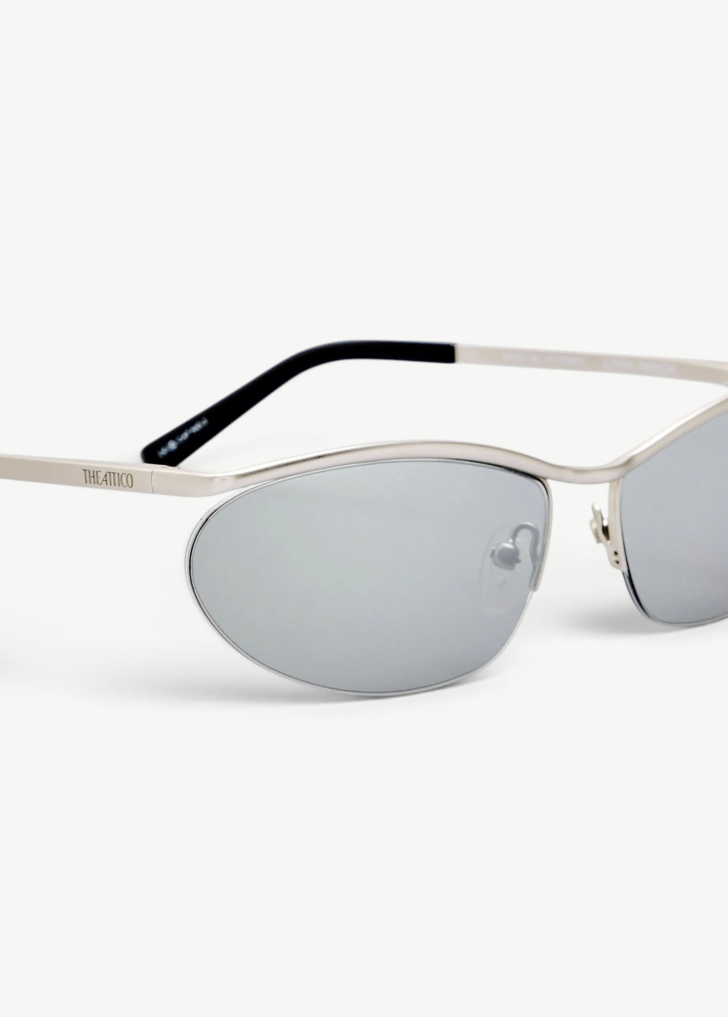 KABE SHOP INC Charlotte cat-eye sunglasses with silver-tone metal frames and dark gray lenses, side view.