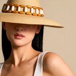 KABE SHOP INC Sine wide brim straw hat with a decorative wooden bead band worn by a woman in a white tank top