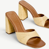 KABE SHOP INC Sloane Heel sandals featuring a tan leather footbed and a woven raffia block heel in a natural beige.