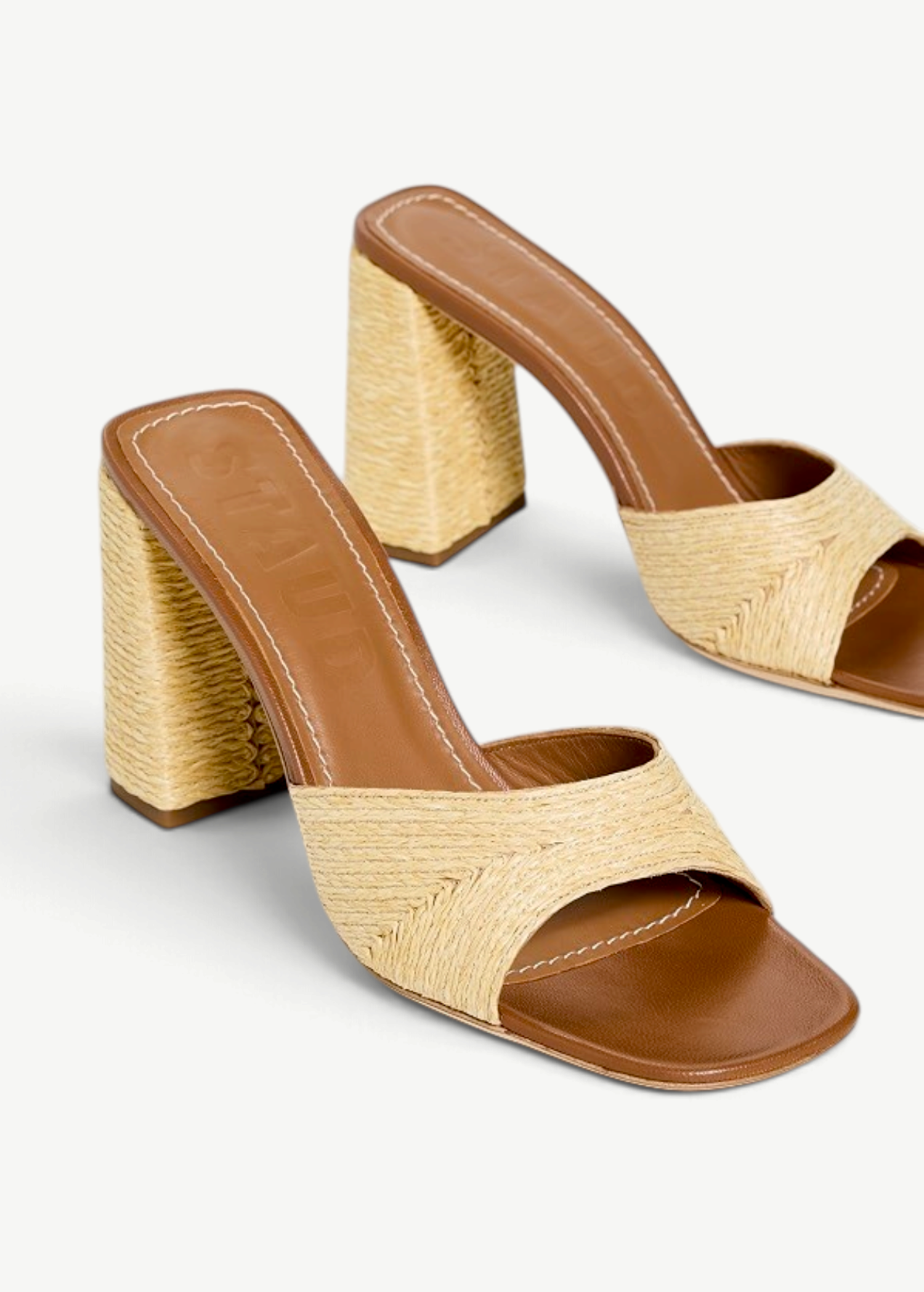 KABE SHOP INC Sloane Heel sandals featuring a tan leather footbed and a woven raffia block heel in a natural beige.