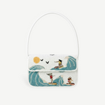 KABE SHOP INC Tommy shoulder bag featuring a white base with a colorful beaded surfing scene and a white handle.