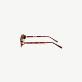 KABE SHOP INC Ambra oval sunglasses in tortoise shell pattern with gold logo detail, side profile view