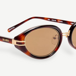 KABE Ambra oval sunglasses featuring a tortoiseshell frame, gold-tone accents, and brown gradient lenses.