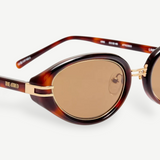KABE Ambra oval sunglasses featuring a tortoiseshell frame, gold-tone accents, and brown gradient lenses.