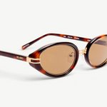 KABE SHOP INC Ambra oval sunglasses featuring a tortoiseshell frame, gold-tone accents, and brown gradient lenses.