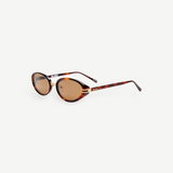 KABE Ambra oval sunglasses featuring a tortoiseshell frame, gold-tone accents, and brown gradient lenses.
