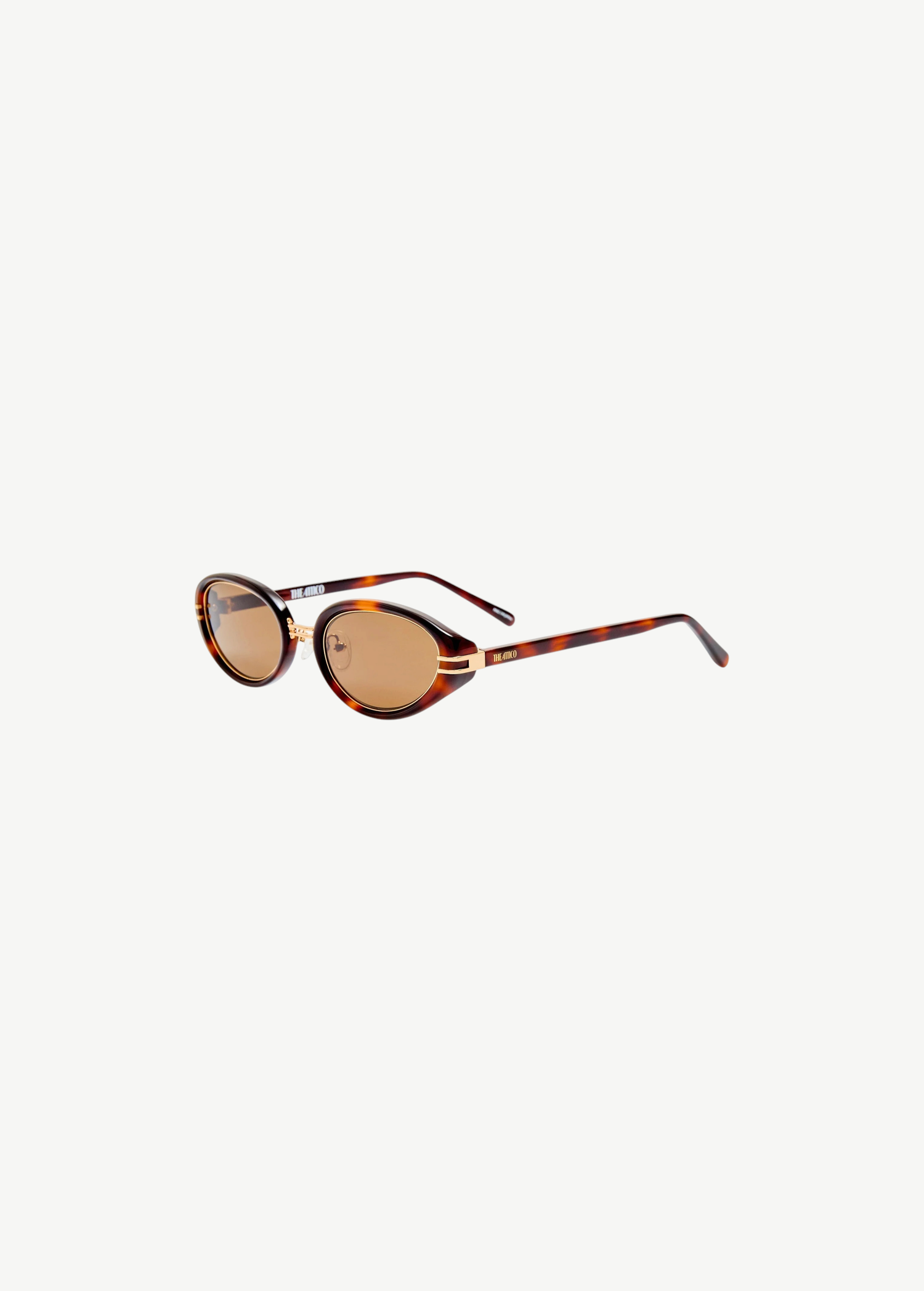 KABE SHOP INC Ambra oval sunglasses featuring a tortoiseshell frame, brown gradient lenses, and gold-tone metal accents.