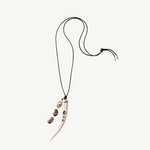 KABE SHOP INC Tusk Charm Necklace with carved white bone pendant, gemstone inlay, and cascading abalone tassel on cord