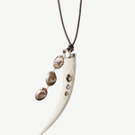 KABE SHOP INC Tusk Charm Necklace with carved white bone, gemstone inlay, and iridescent abalone tassel on leather.