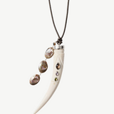 KABE SHOP INC Tusk Charm Necklace with carved white bone, gemstone inlay, and iridescent abalone tassel on leather.