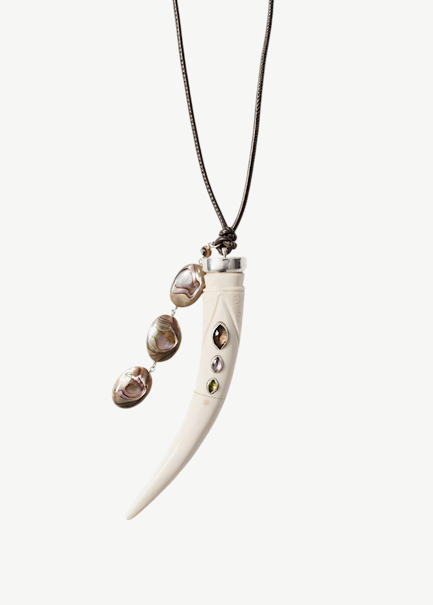 KABE SHOP INC Tusk Charm Necklace with carved white bone, gemstone inlay, and iridescent abalone tassel on leather.