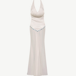 KABE SHOP INC Vicka dress in white satin with an open back, halter neck, and vibrant bead embroidery at the waist.