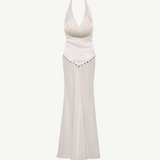 KABE SHOP INC Vicka dress in white satin with an open back, halter neck, and vibrant bead embroidery at the waist.