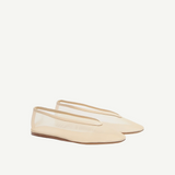 A pair of beige Luna Slipper Shoes, featuring a minimalist design with a slightly pointed toe, thin soles, and a low-cut silhouette crafted from glossy patent leather, displayed on a white background.