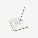 KABE SHOP INC Oh Mon Dieu! white porcelain incense holder featuring a sculptural pair of lips with a burning stick.