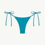 The Praia Bottom is a bright blue bikini bottom featuring a high-cut front and adjustable side string ties, crafted from regenerated nylon for an eco-friendly swimwear choice and displayed against a plain white background.