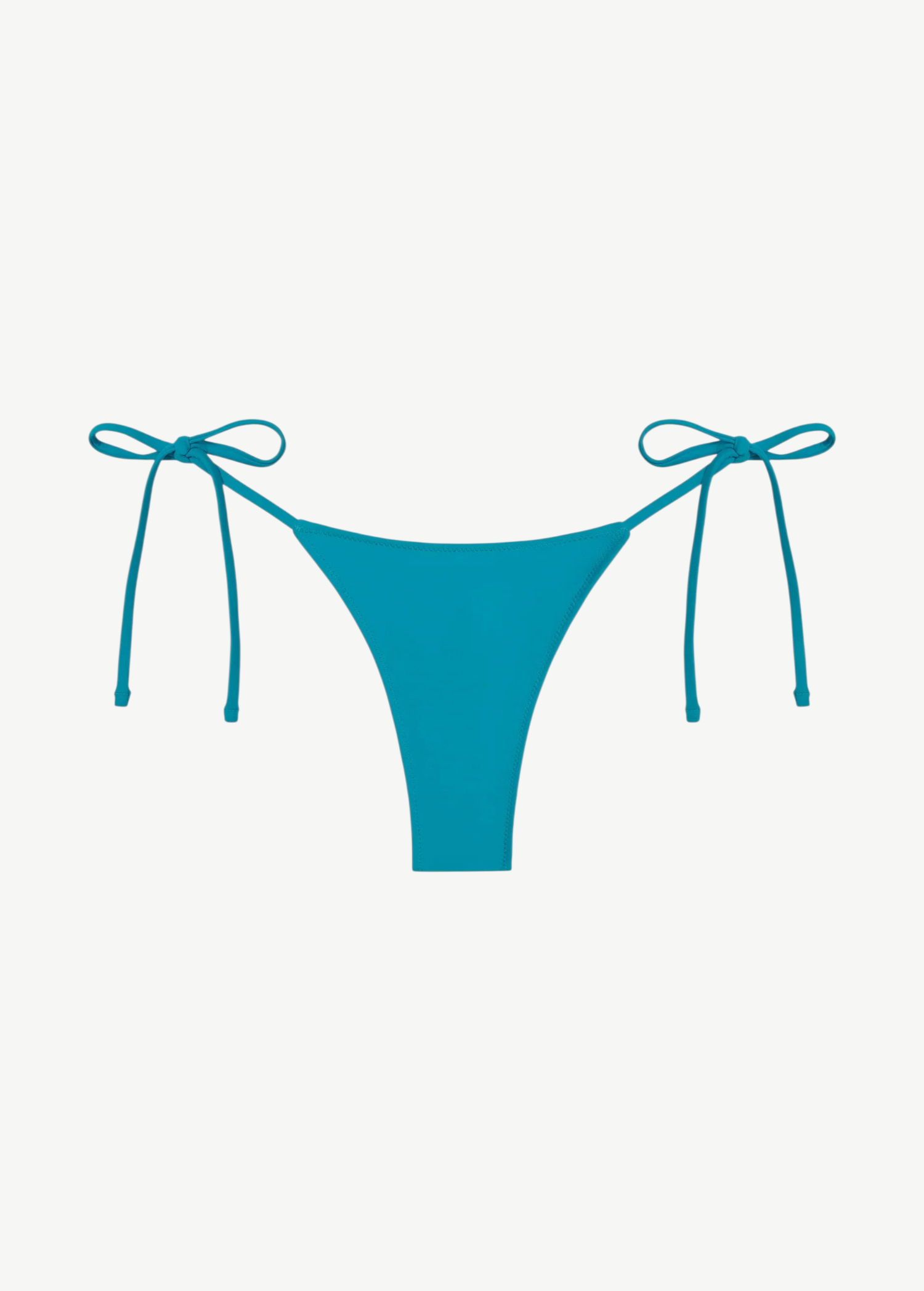 The Praia Bottom is a bright blue bikini bottom featuring a high-cut front and adjustable side string ties, crafted from regenerated nylon for an eco-friendly swimwear choice and displayed against a plain white background.