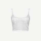 The Emma Knit Top is a sheer white mesh crop top featuring wide straps, a scoop neckline, and delicate hibiscus floral lace details on the front, displayed against a plain white background.