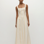 Model wearing a KABE SHOP INC Lenice midi dress in yellow and white plaid linen with a square neckline