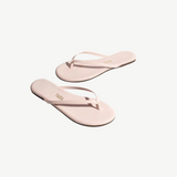 KABE SHOP INC Lily Glosses pale pink patent leather flip flops with cushioned insoles and rubber outsoles.