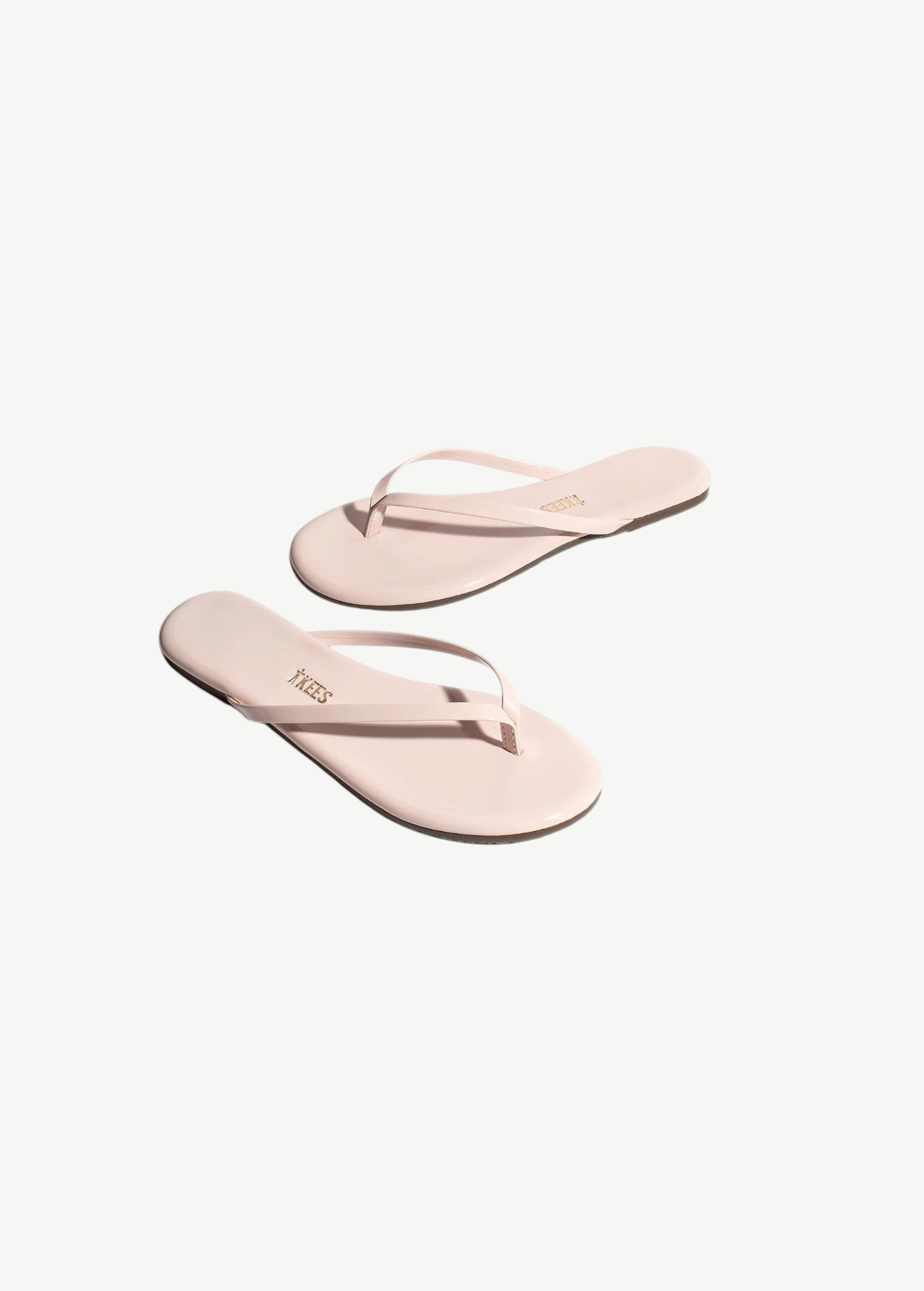 KABE SHOP INC Lily Glosses pale pink patent leather flip flops with cushioned insoles and rubber outsoles.