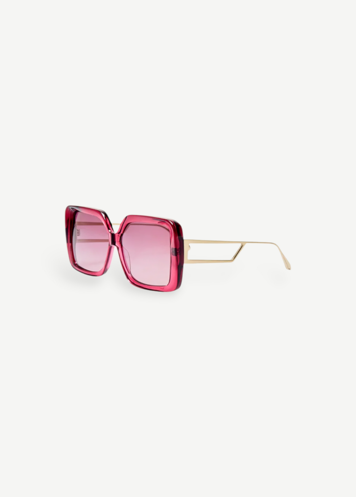 The Macy Sunglasses feature a square-shaped, oversized frame crafted from luxurious Italian acetate in bold pink, with light pink gradient lenses and elegant gold-plated temples and thin arms, showcased on a white background.