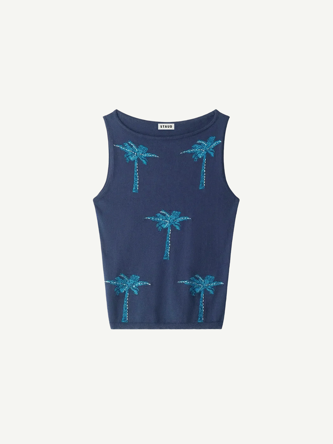 Arden Top, a navy blue sleeveless knit featuring a pattern of five embroidered turquoise palm trees, a warm-weather essential.