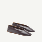 A pair of Luna Slipper Shoes in dark brown leather, featuring a minimalist design with subtle leather detailing and almond-shaped toes, displayed against a plain white background.