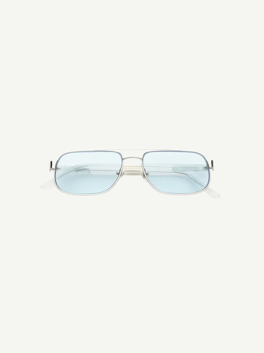 Front view of Evangeline rectangular sunglasses featuring a thin stainless steel frame and light blue tinted lenses that offer UV protection, set against a plain white background.