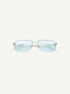 Front view of Evangeline rectangular sunglasses featuring a thin stainless steel frame and light blue tinted lenses that offer UV protection, set against a plain white background.