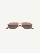 Evangeline sunglasses feature a rectangular gold metal frame with brown tinted lenses and slim arms, offering UV protection and crafted from durable stainless steel, presented on a white background facing forward.