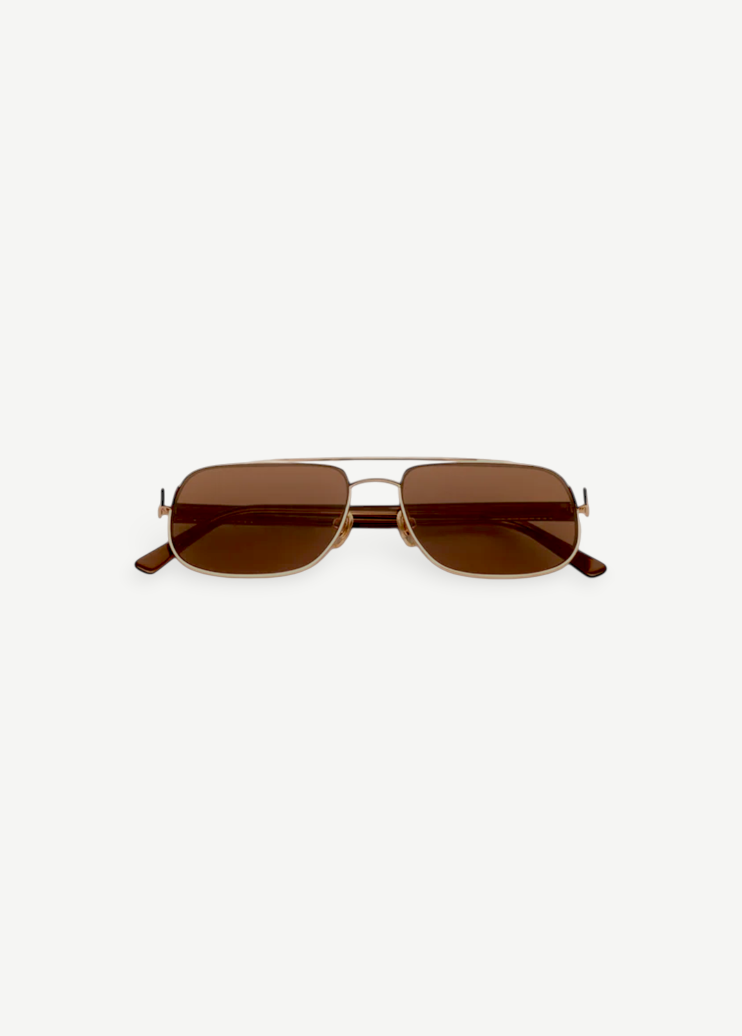 Evangeline sunglasses feature a rectangular gold metal frame with brown tinted lenses and slim arms, offering UV protection and crafted from durable stainless steel, presented on a white background facing forward.