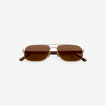 Evangeline sunglasses feature a rectangular gold metal frame with brown tinted lenses and slim arms, offering UV protection and crafted from durable stainless steel, presented on a white background facing forward.