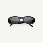 Jordyn rectangular black sunglasses with dark lenses, shown from the front against a plain white background. The crossed arms at the back add style, while Jordyn offers reliable UV protection for sunny days—perfect festival sunglasses.
