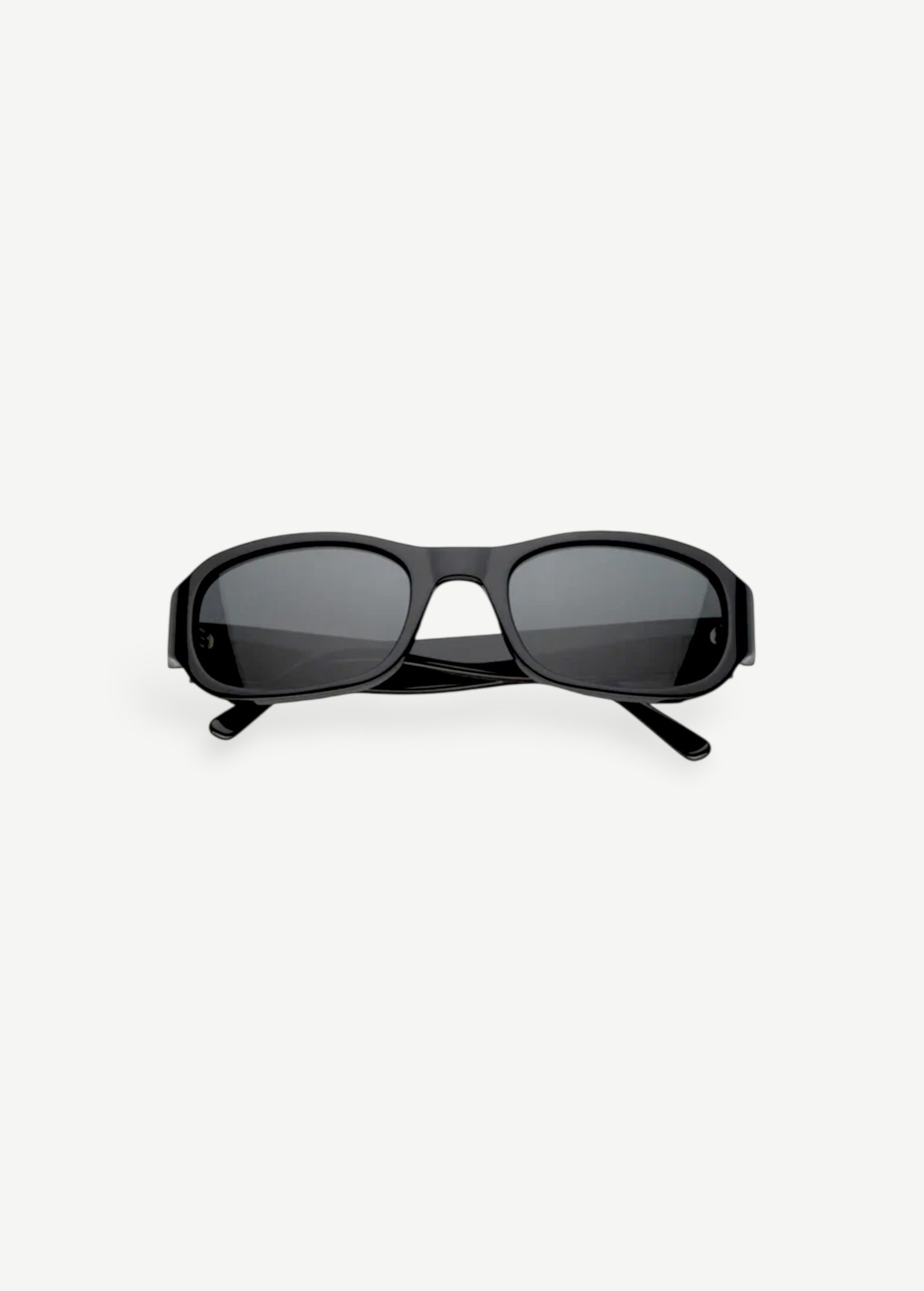 Jordyn rectangular black sunglasses with dark lenses, shown from the front against a plain white background. The crossed arms at the back add style, while Jordyn offers reliable UV protection for sunny days—perfect festival sunglasses.