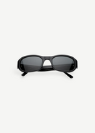 Jordyn rectangular black sunglasses with dark lenses, shown from the front against a plain white background. The crossed arms at the back add style, while Jordyn offers reliable UV protection for sunny days—perfect festival sunglasses.
