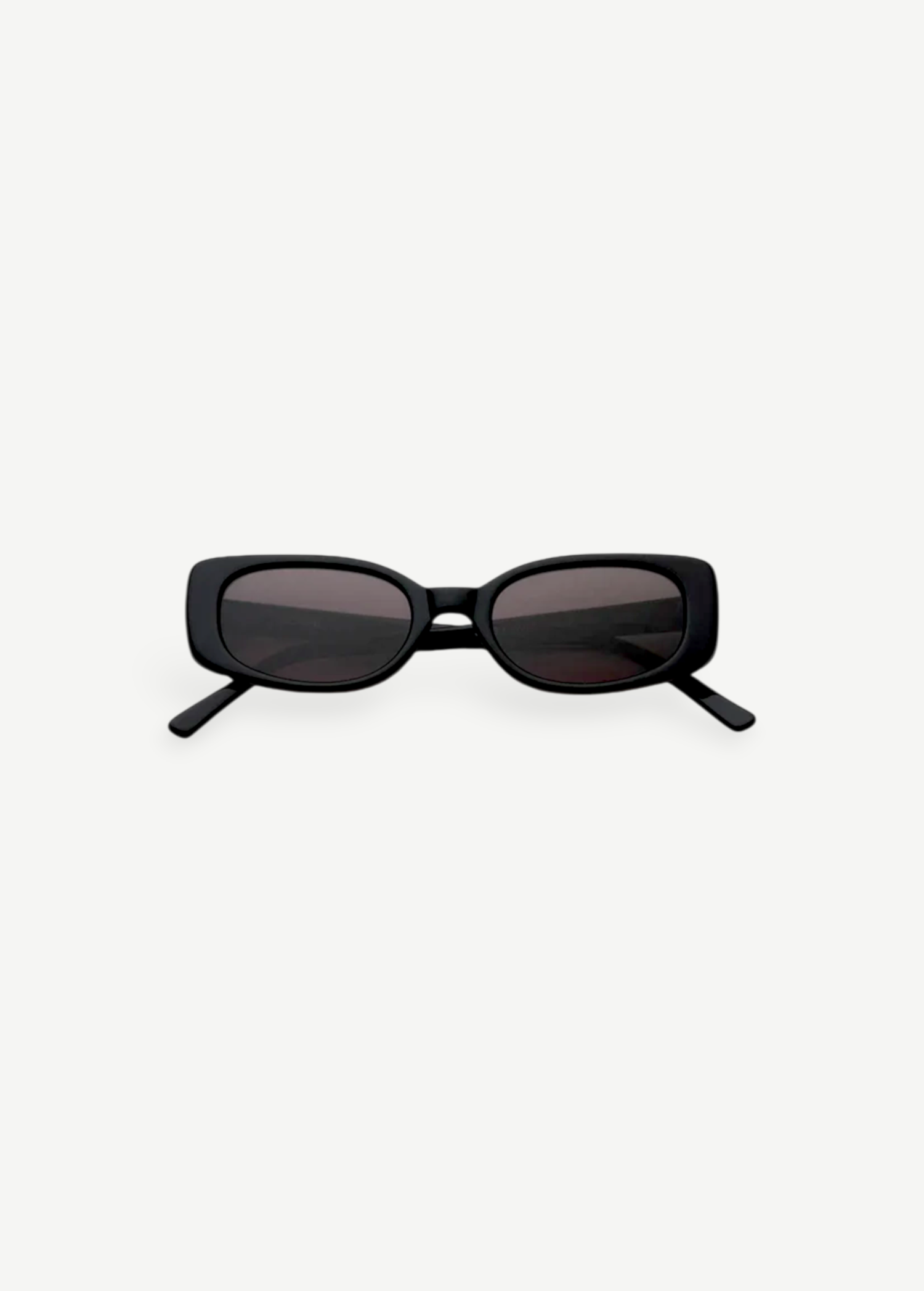 The Solene sunglasses feature a black slim rectangular frame with dark tinted lenses that provide 100% UV protection, displayed front-facing against a plain white background.