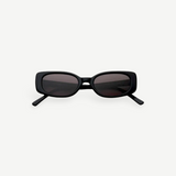 The Solene sunglasses feature a black slim rectangular frame with dark tinted lenses that provide 100% UV protection, displayed front-facing against a plain white background.