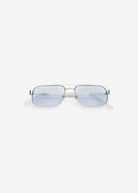 Front view of Evangeline rectangular sunglasses featuring a thin stainless steel frame and light blue tinted lenses that offer UV protection, set against a plain white background.
