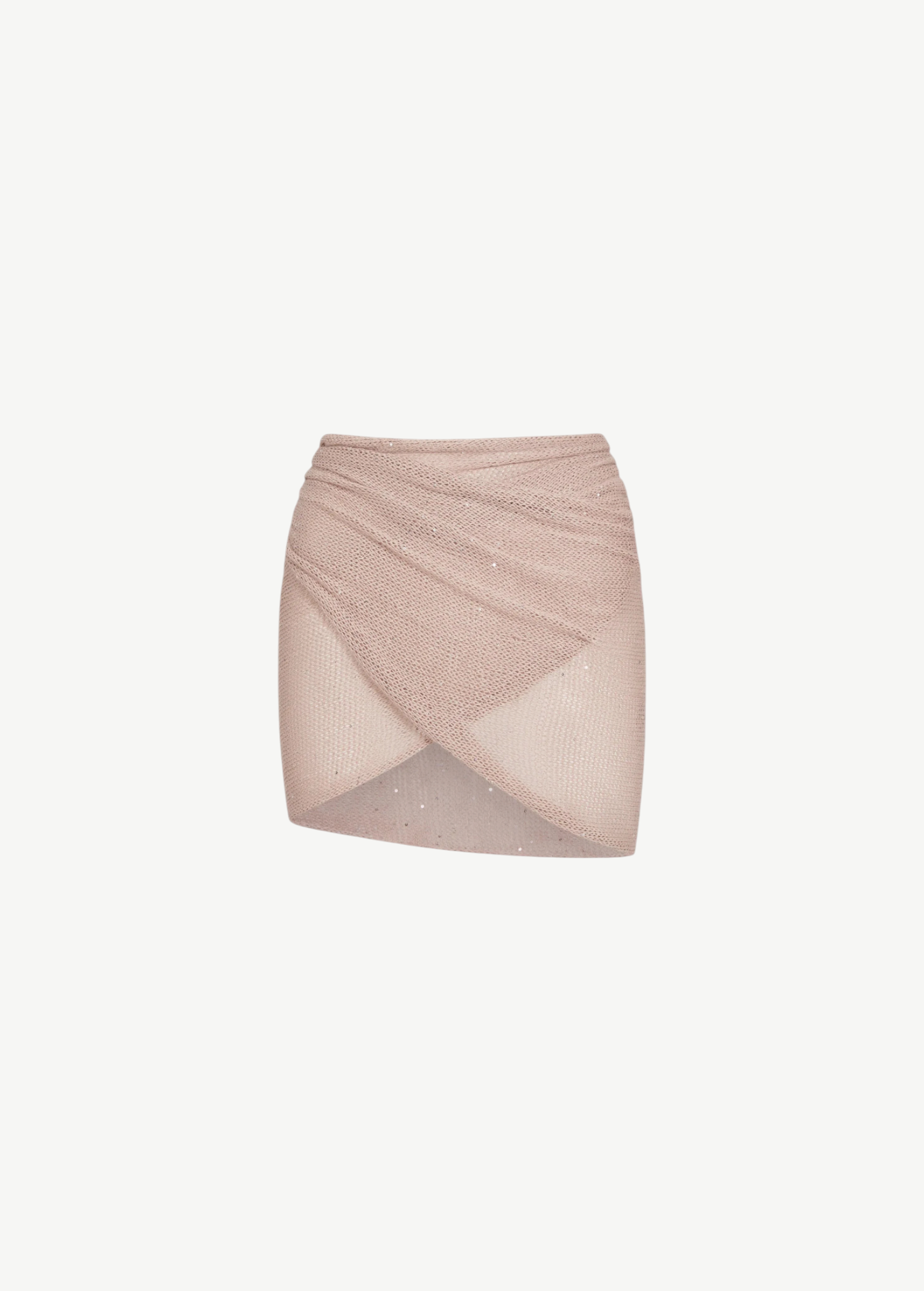 The Lumiere Skirt is a light pink, textured knit mini skirt with a criss-cross, wrap-style front and subtle sparkle details, featuring sequin bead accents for added shimmer, isolated on a white background.