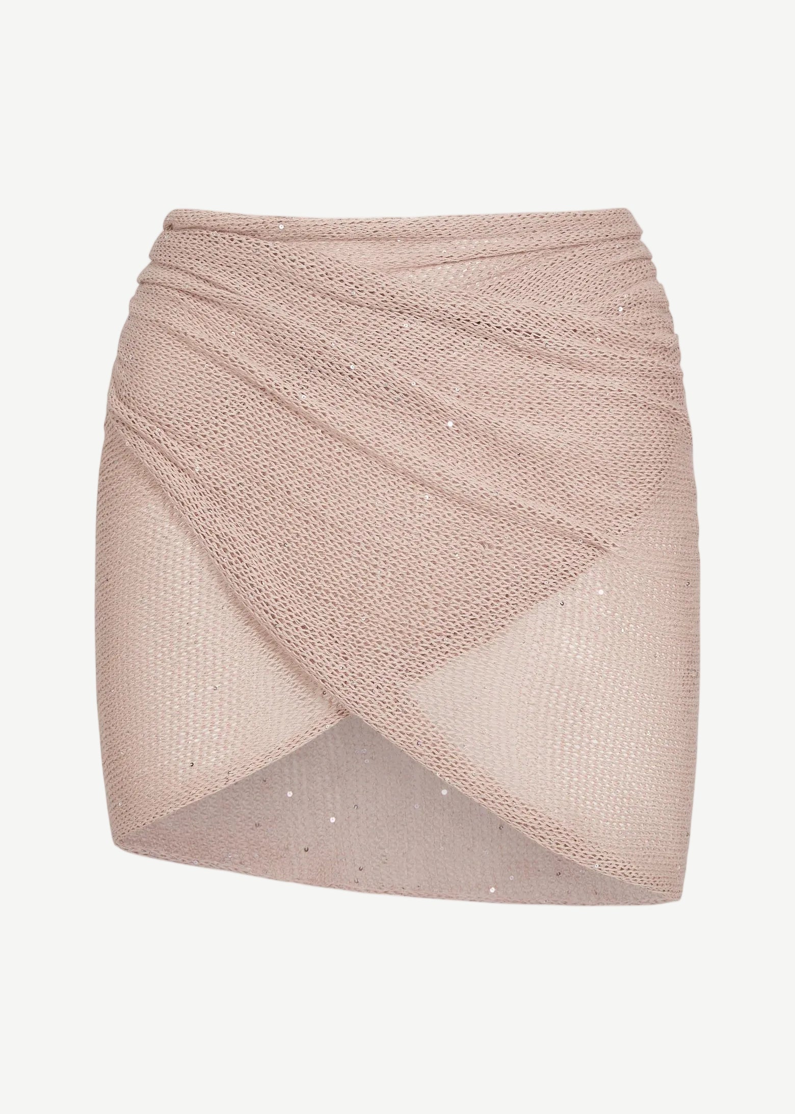 The Lumiere Skirt is a light pink, textured knit mini skirt with a criss-cross, wrap-style front and subtle sparkle details, featuring sequin bead accents for added shimmer, isolated on a white background.