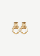 Elsa Earrings feature a pierced back and three rounded gold-plated bars stacked above a thick, oval-shaped loop, shown against a plain white background. Crafted with 14KT gold plating, these earrings are stylish, lightweight, and ideal for everyday wear.