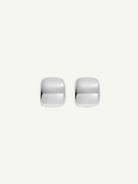 Two small, shiny Pebble Earrings with a square shape and rounded edges are placed side by side on a plain white background. Each earring measures approximately 1 inch in length and features a lustrous rhodium plate finish.
