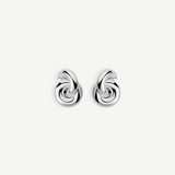 The Rhodium Amina Earrings are featured on a plain white background, showcasing an intricate interwoven knot design with a polished, shiny finish and a secure pierced back.