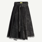 Introducing the Midi Kilt Skirt with Buckle Fastening: a black acid wash, knee-length skirt featuring pleats, an uneven raw hem with frayed edges, and a matching belt tied at the waist. The washed, slightly faded denim lends effortless edge to this distinctive midi skirt.