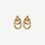 The Ami Earrings are a pair of pierced back earrings, each showcasing three interlocking circular loops, beautifully crafted in 14KT gold plate with an elegant 1.5-inch drop, shown against a plain white background.