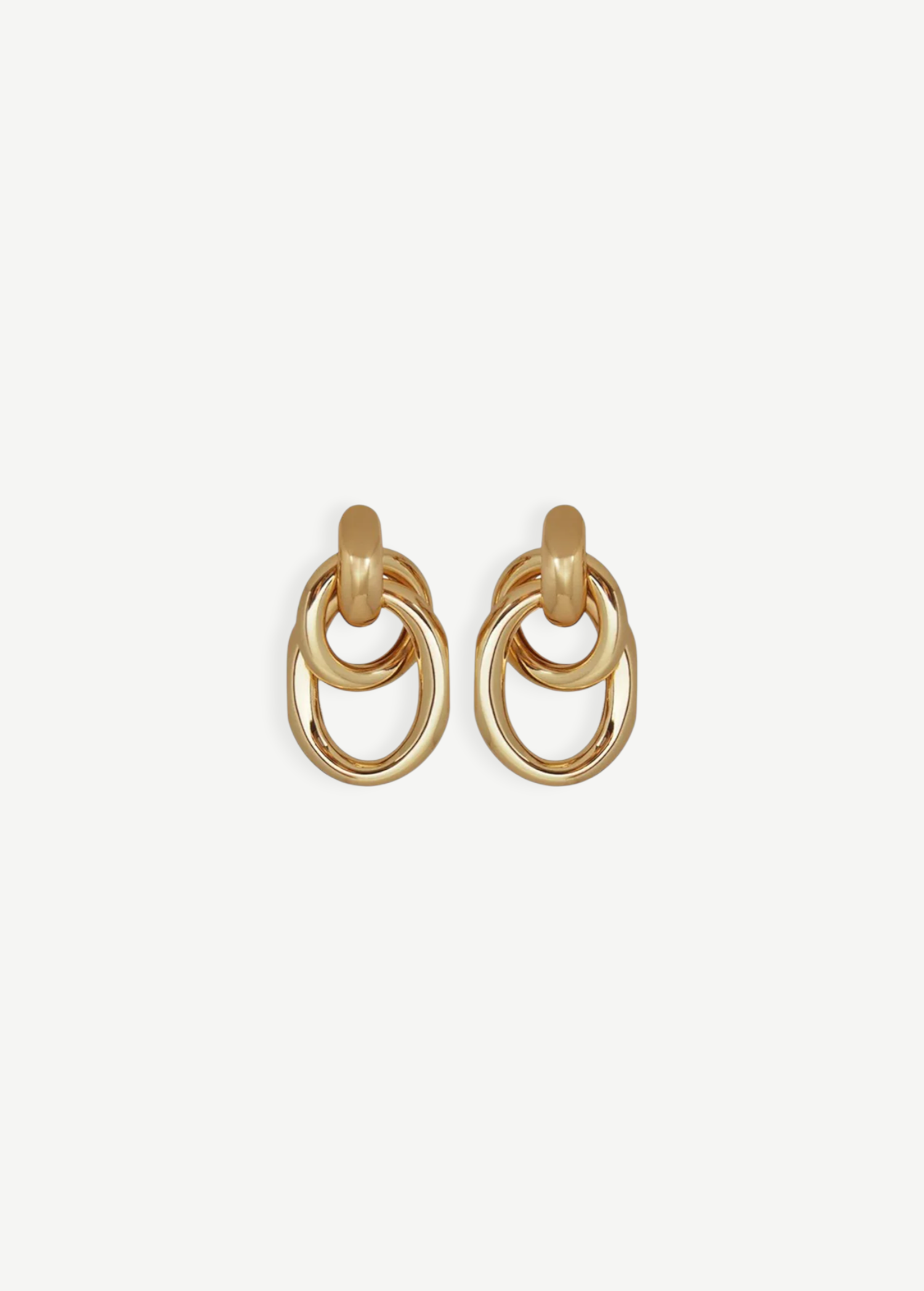 The Ami Earrings are a pair of pierced back earrings, each showcasing three interlocking circular loops, beautifully crafted in 14KT gold plate with an elegant 1.5-inch drop, shown against a plain white background.